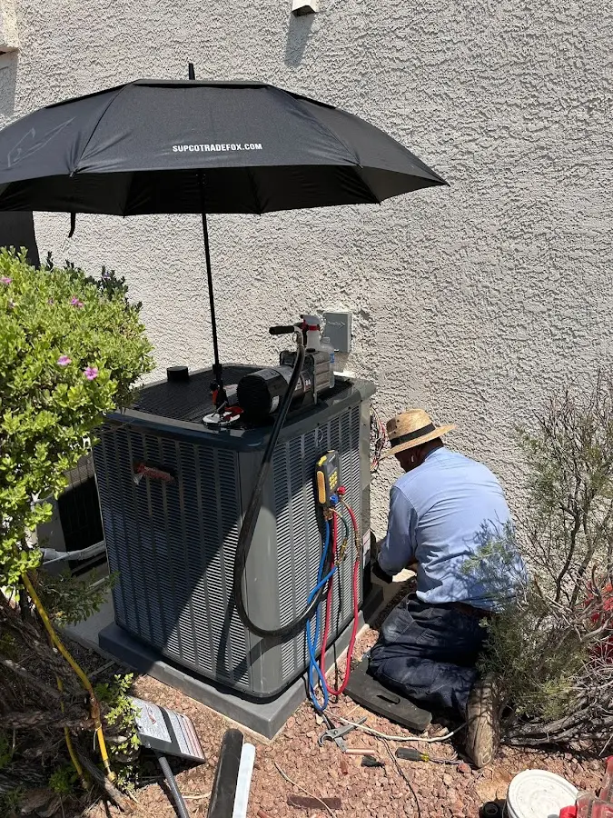 HVAC technician performing outdoor AC maintenance in Sebring